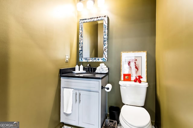 half bath with vanity and toilet