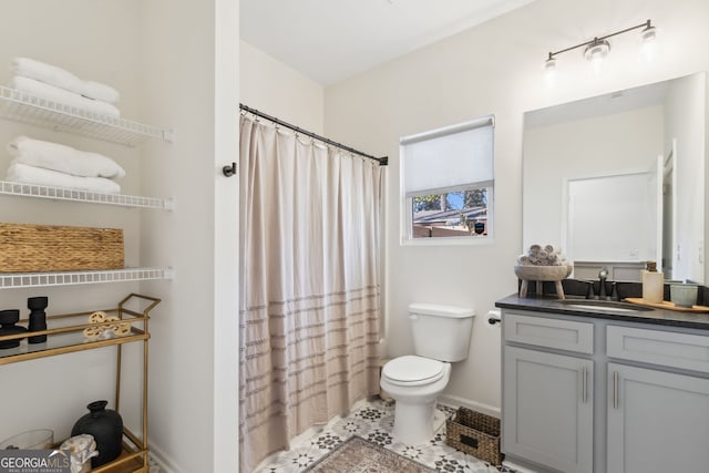 full bath with a shower with shower curtain, toilet, vanity, tile patterned flooring, and baseboards