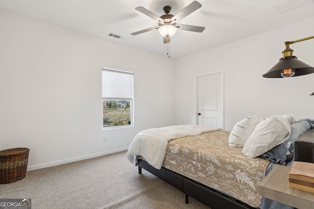 bedroom with ceiling fan, carpet flooring, visible vents, and baseboards