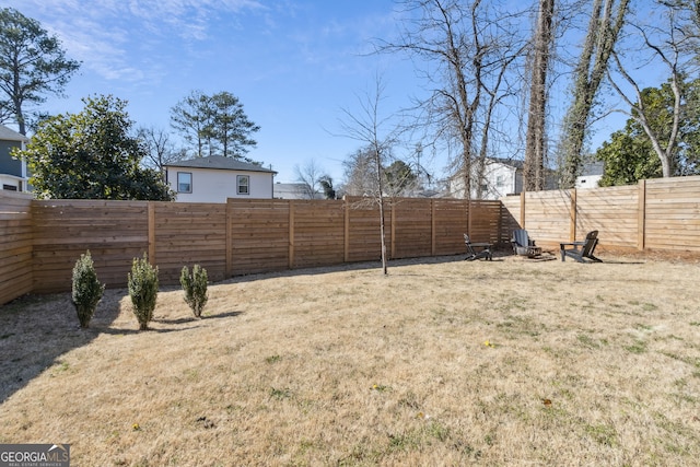 view of yard with a fenced backyard