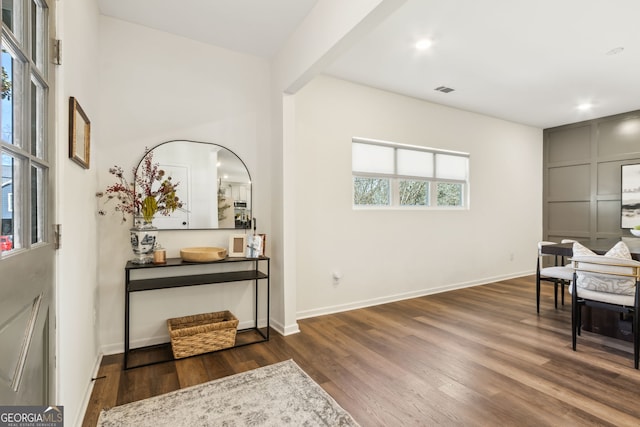 sitting room featuring visible vents, baseboards, wood finished floors, and recessed lighting