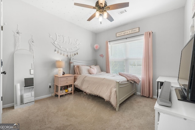 bedroom featuring baseboards, a ceiling fan, visible vents, and light colored carpet