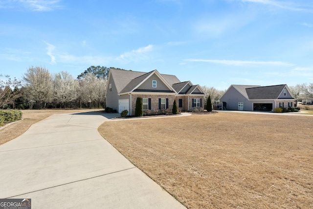 craftsman-style home featuring a garage and concrete driveway