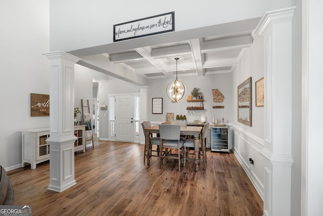 dining space with dark wood-style floors, beverage cooler, decorative columns, and beam ceiling