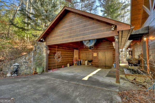 view of car parking with a detached garage