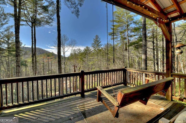 deck with a wooded view