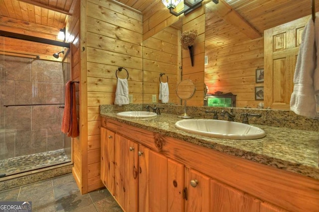 bathroom featuring wood ceiling, a sink, and wood walls