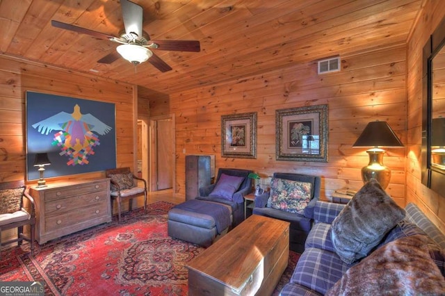 living area with wooden ceiling and visible vents