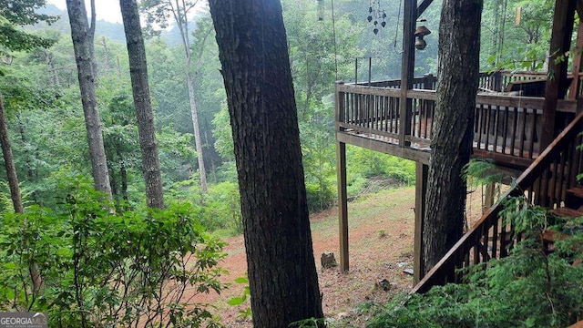 view of yard featuring a wooded view