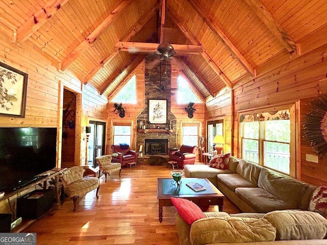 living room featuring wooden ceiling, wood walls, and wood finished floors