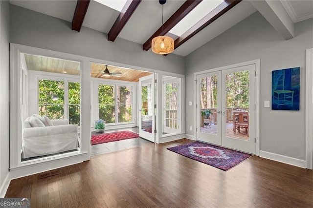 doorway with vaulted ceiling with beams, baseboards, wood finished floors, and french doors