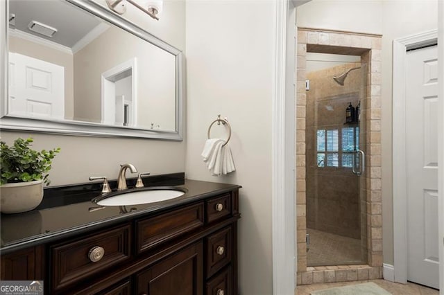 full bathroom with a stall shower, visible vents, ornamental molding, and vanity