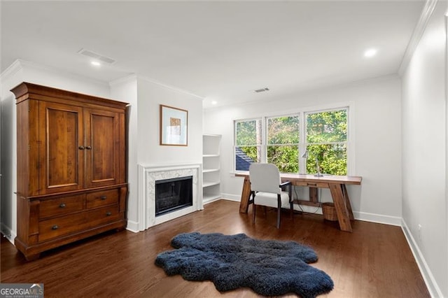 sitting room featuring baseboards, visible vents, dark wood-style flooring, and a glass covered fireplace