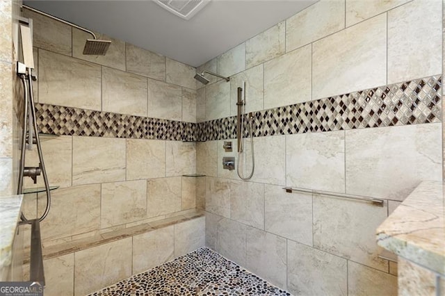 room details with visible vents and tiled shower