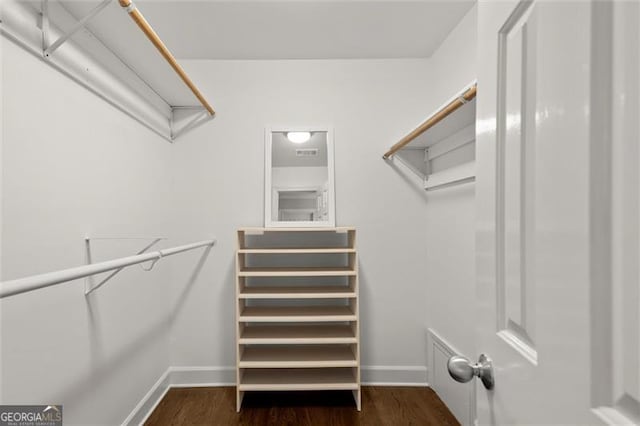 spacious closet with wood finished floors and visible vents