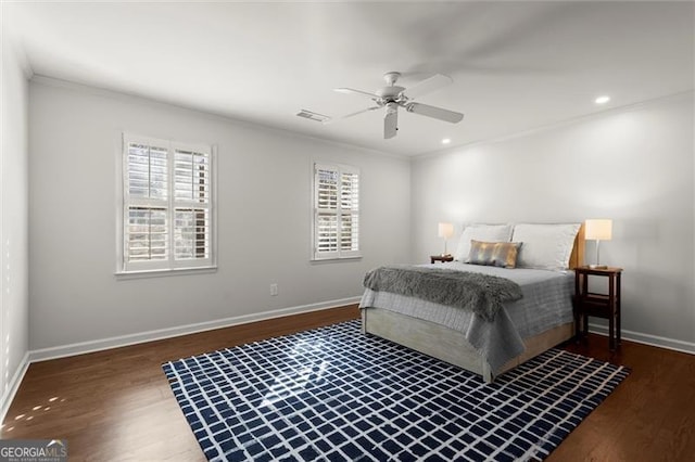 bedroom with recessed lighting, visible vents, baseboards, and wood finished floors