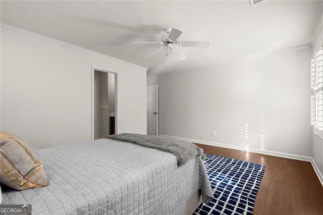 bedroom with ornamental molding, dark wood-style flooring, baseboards, and a ceiling fan