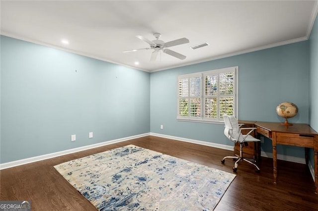 office space with ornamental molding, wood finished floors, visible vents, and baseboards