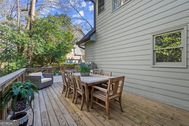 wooden deck with outdoor dining area