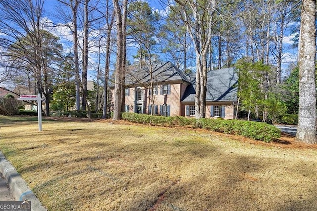 view of front of property with a front lawn