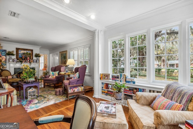 sunroom featuring a fireplace and visible vents