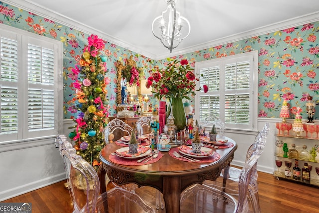 dining area with an inviting chandelier, wallpapered walls, and wood finished floors