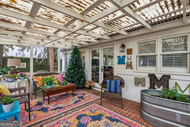 sunroom / solarium featuring french doors