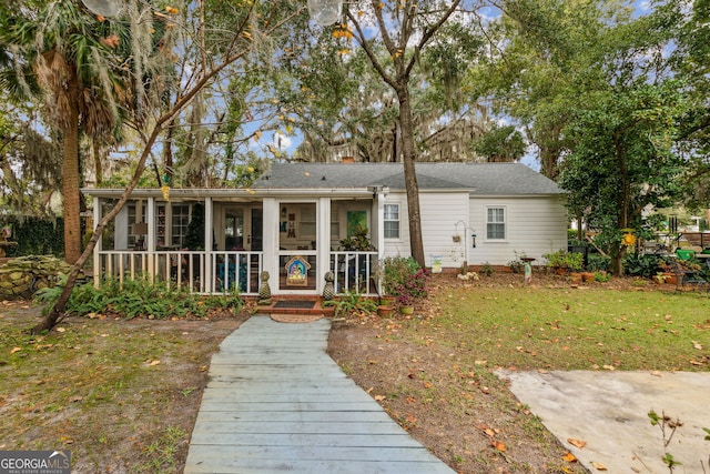 view of front of home with a sunroom