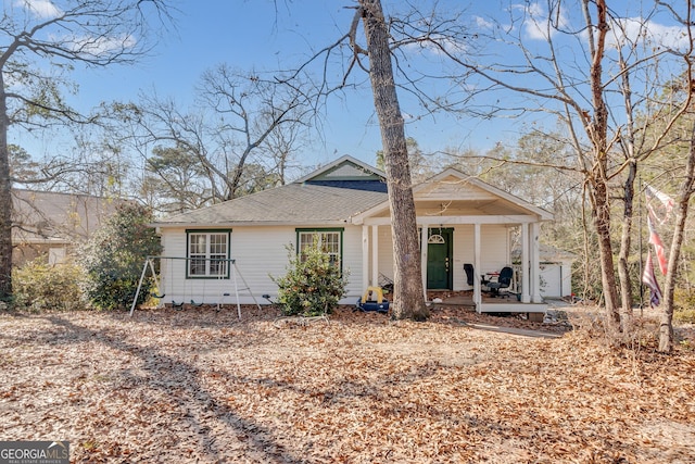 view of front of home featuring a porch and a shingled roof