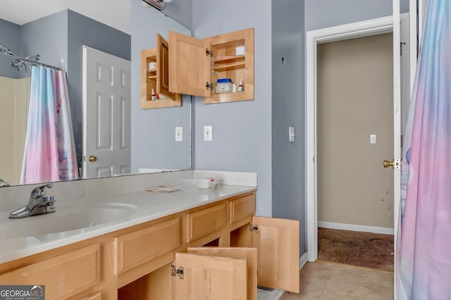 111 Laurel Oak Ln, Warner Robins, GA 31093 - full bathroom featuring curtained shower, tile patterned flooring, baseboards, and vanity