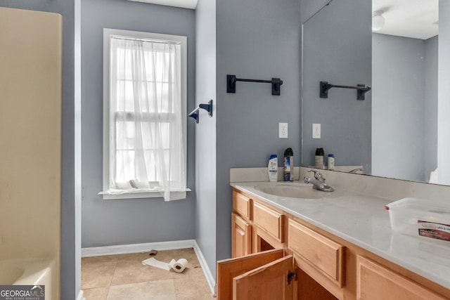 111 Laurel Oak Ln, Warner Robins, GA 31093 - bathroom with baseboards, vanity, and tile patterned floors