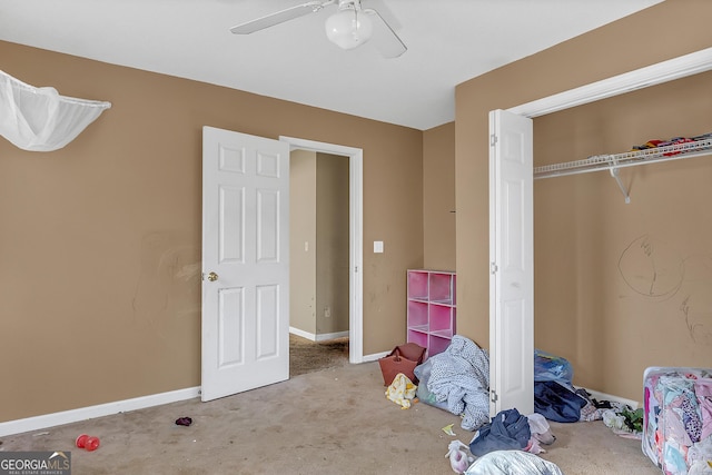 111 Laurel Oak Ln, Warner Robins, GA 31093 - unfurnished bedroom with carpet floors, a closet, baseboards, and a ceiling fan