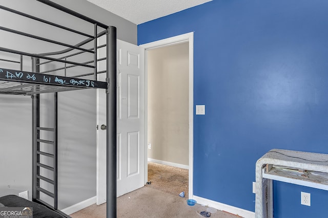 111 Laurel Oak Ln, Warner Robins, GA 31093 - unfurnished bedroom featuring a textured ceiling and baseboards