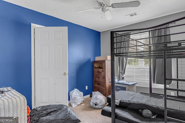 111 Laurel Oak Ln, Warner Robins, GA 31093 - bedroom featuring a textured ceiling, ceiling fan, carpet floors, visible vents, and baseboards