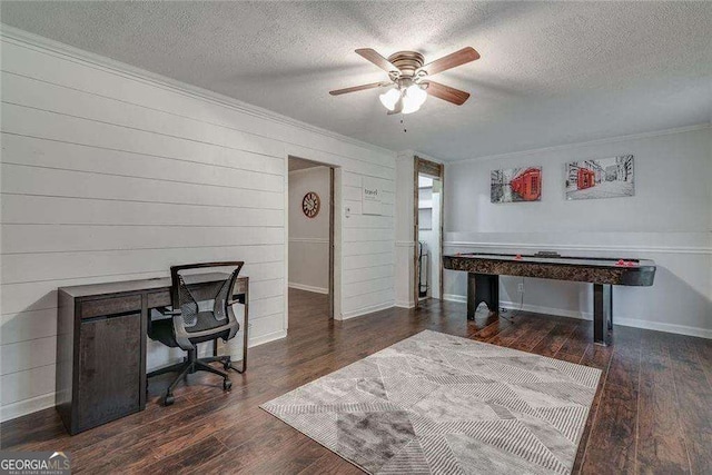 office area featuring baseboards, a ceiling fan, ornamental molding, wood finished floors, and a textured ceiling