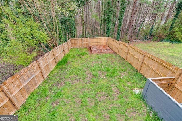 view of yard featuring a fenced backyard