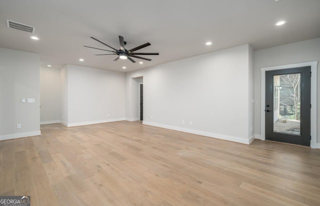 unfurnished room with light wood finished floors, a ceiling fan, visible vents, and recessed lighting