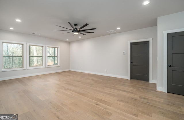 unfurnished room featuring light wood-style floors, baseboards, and recessed lighting