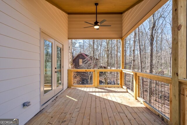 unfurnished bedroom with light wood-type flooring, ceiling fan, and baseboards