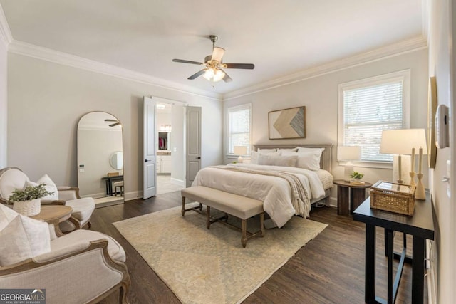 bedroom with baseboards, arched walkways, connected bathroom, dark wood-style floors, and crown molding