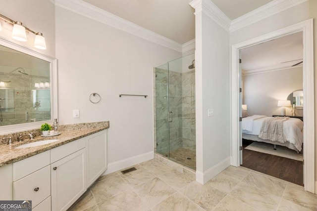 ensuite bathroom featuring baseboards, a shower stall, visible vents, and crown molding