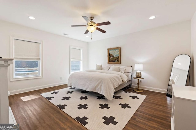 bedroom with dark wood-style floors, recessed lighting, and baseboards