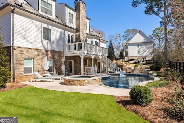 back of property featuring a chimney, stairs, fence, a patio area, and brick siding