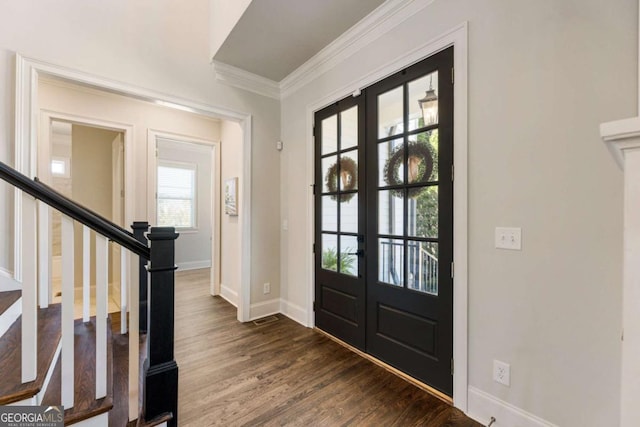 foyer featuring french doors, crown molding, stairway, dark wood-type flooring, and baseboards