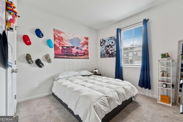 carpeted bedroom featuring baseboards