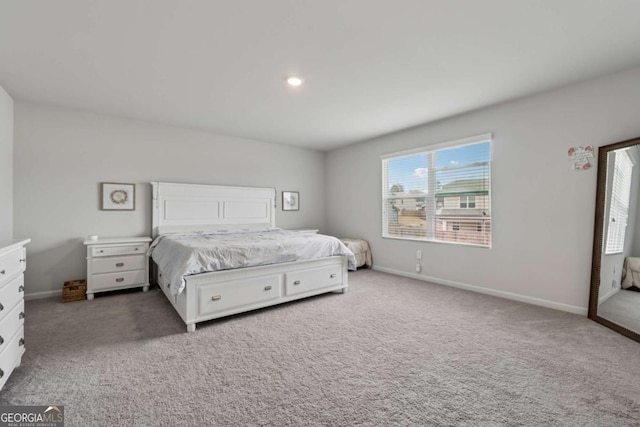 carpeted bedroom with baseboards