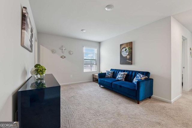 living room with carpet floors and baseboards