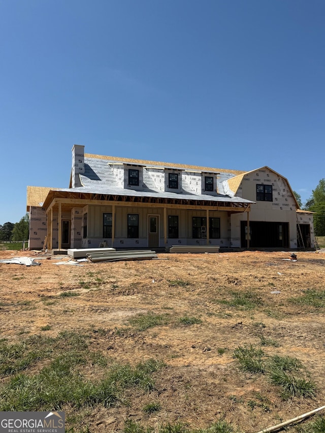 1237 Morgan Rd, Bremen, GA 30110 - rear view of house with a chimney and board and batten siding