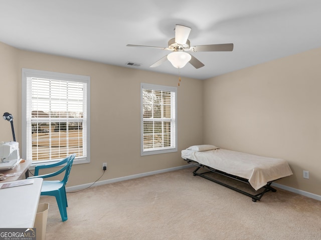 bedroom with baseboards, visible vents, carpet floors, and ceiling fan