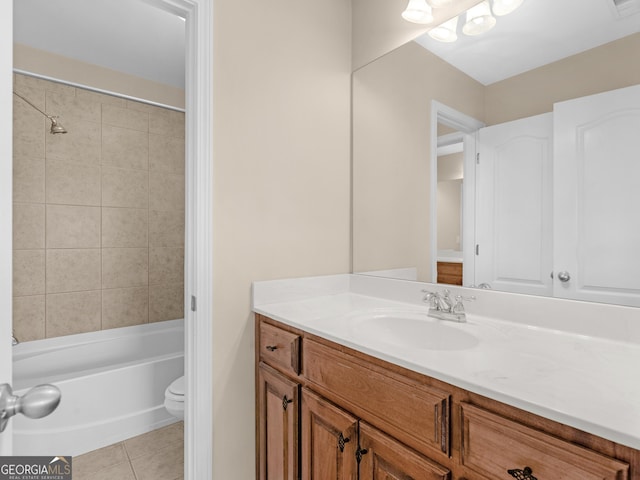 full bathroom with shower / bathing tub combination, toilet, vanity, and tile patterned flooring